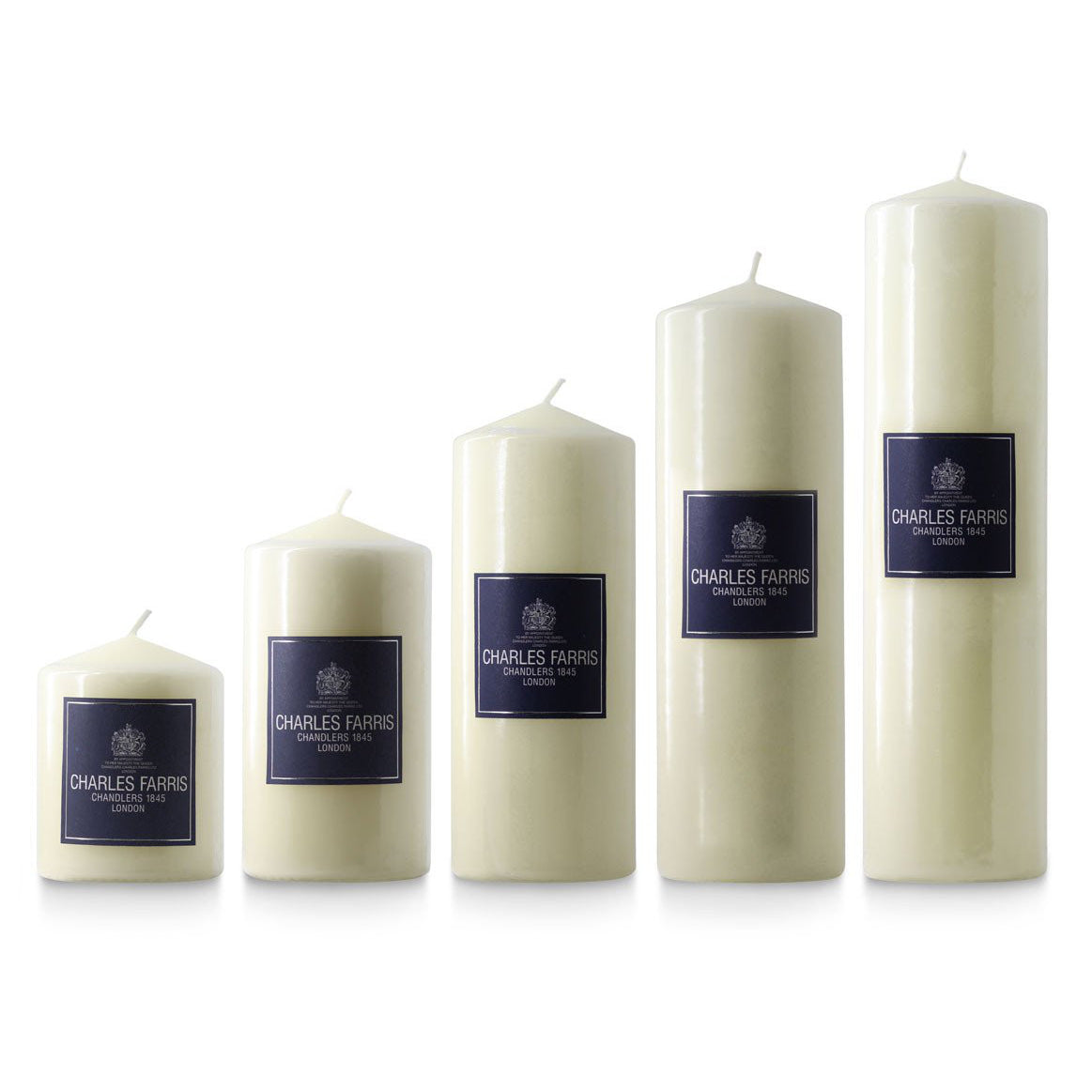 Set of five white candles with blue labels on a white background