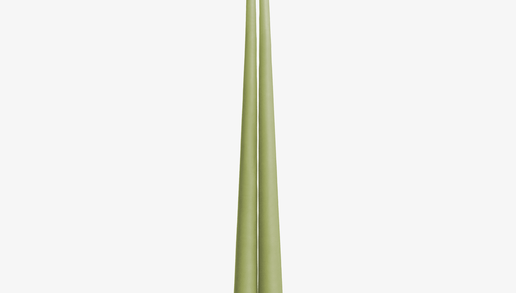 Two green candles on a white background