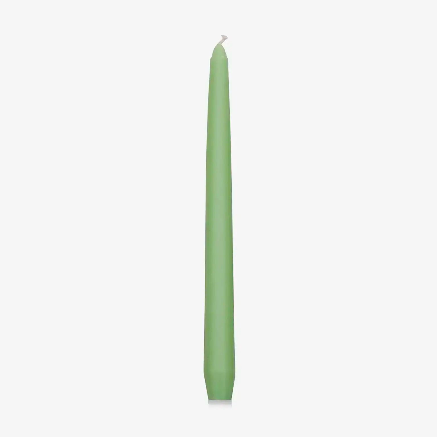 Green dinner candle on a white background