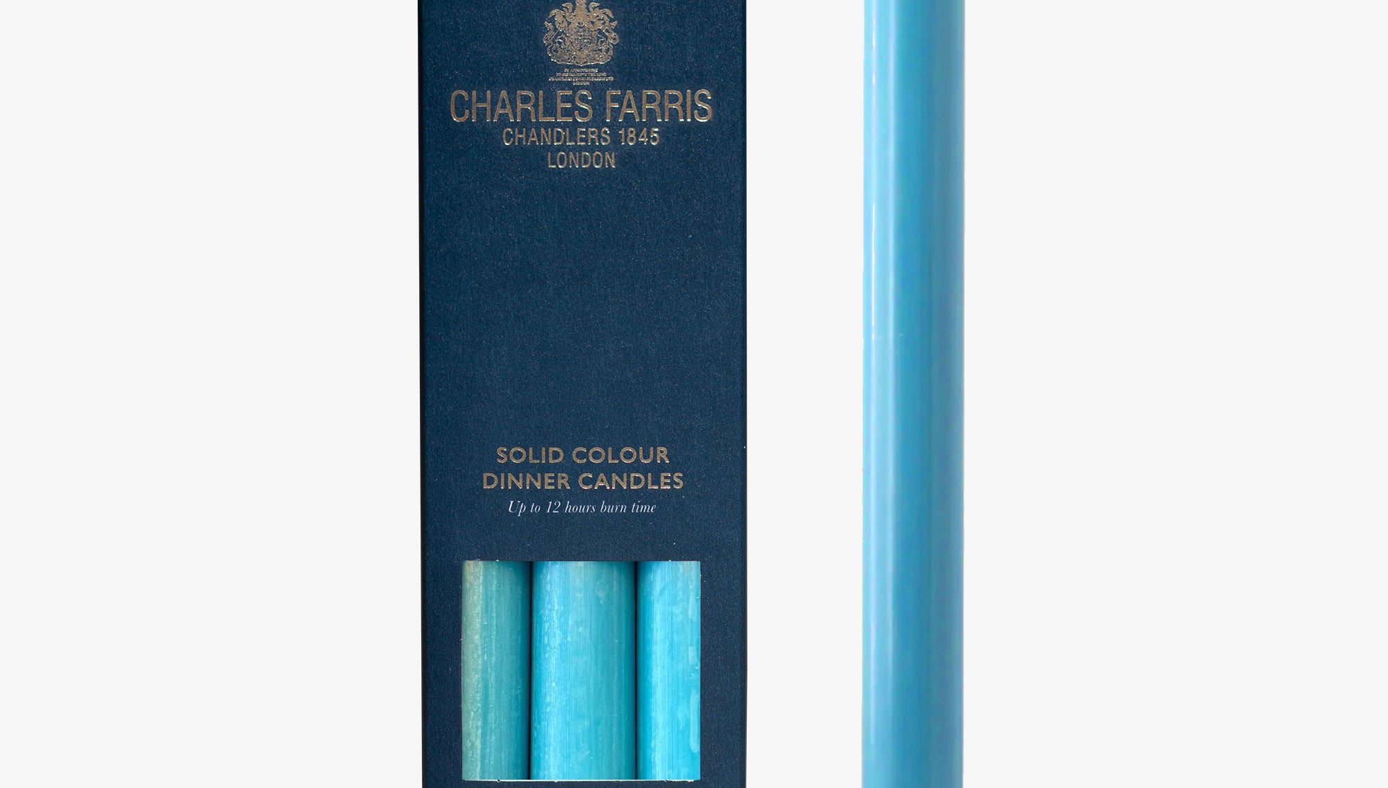 Azure Blue candle next to its packaging with 'Charles Farris' branding on a white background