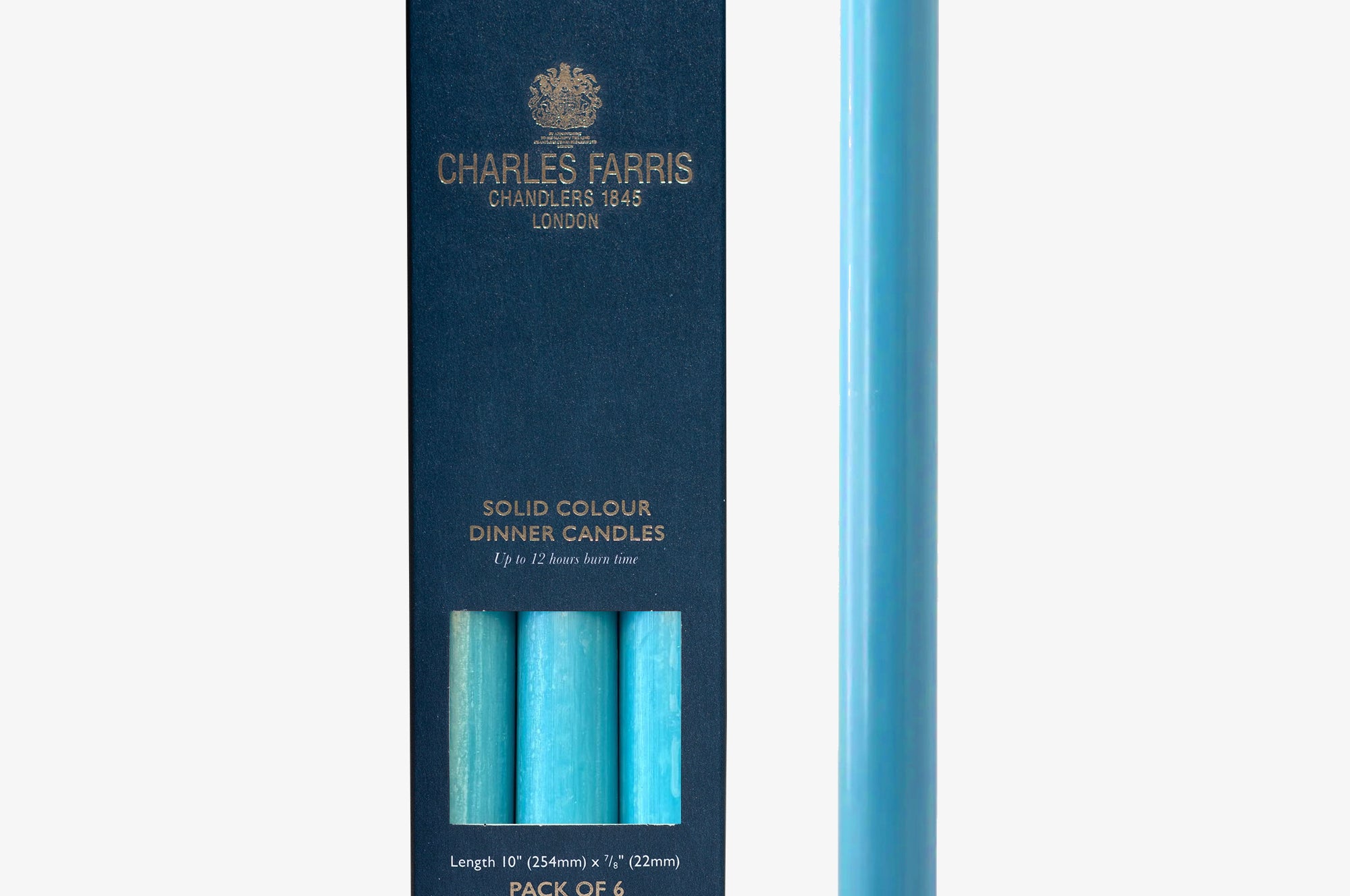 Azure Blue candle next to its packaging with 'Charles Farris' branding on a white background