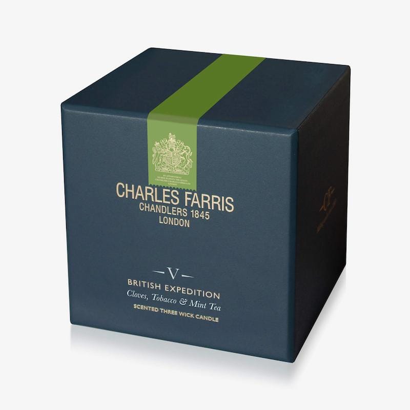 Dark blue candle box with green stripe featuring Charles Farris branding on a white background