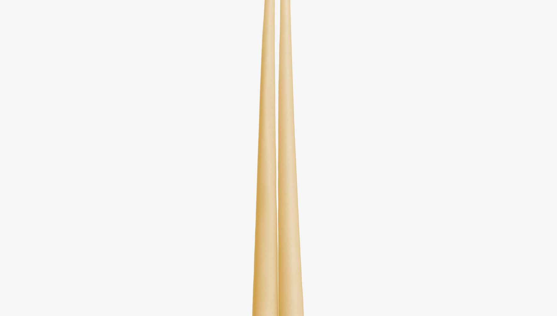 Two ivory candles on a white background