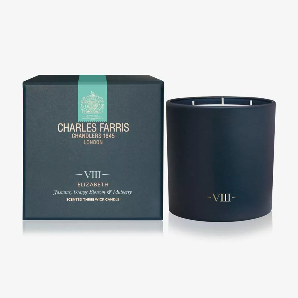 Dark blue candle with 'Charles Farris' packaging on a white background
