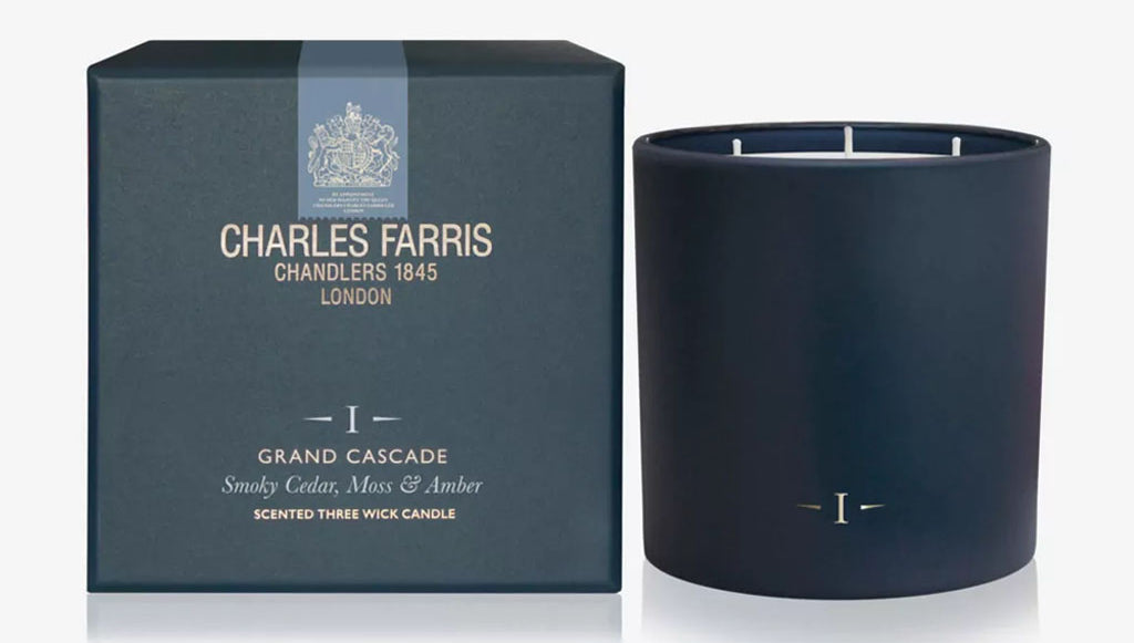 Dark blue candle with 'Charles Farris' packaging on a white background