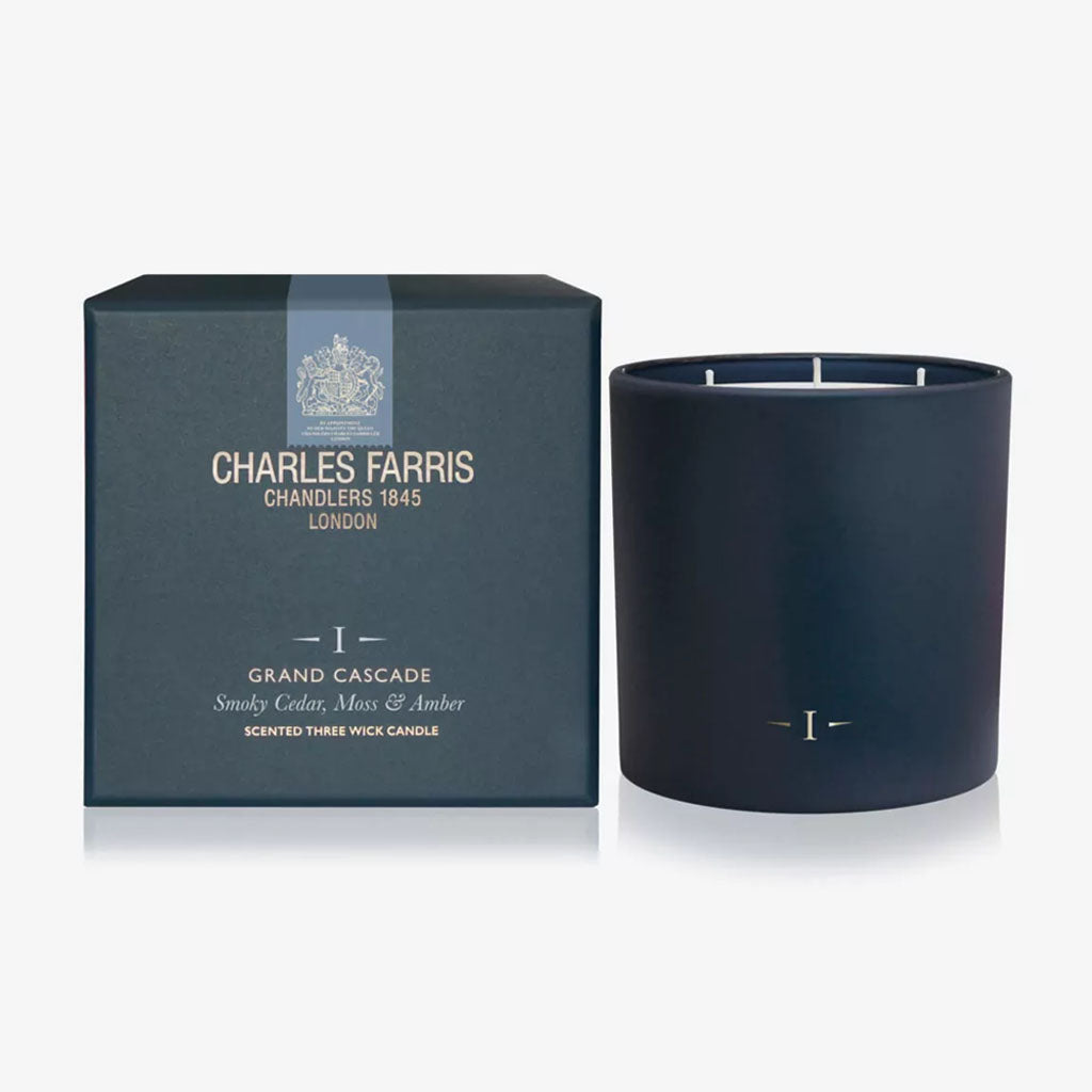 Dark blue candle with 'Charles Farris' packaging on a white background