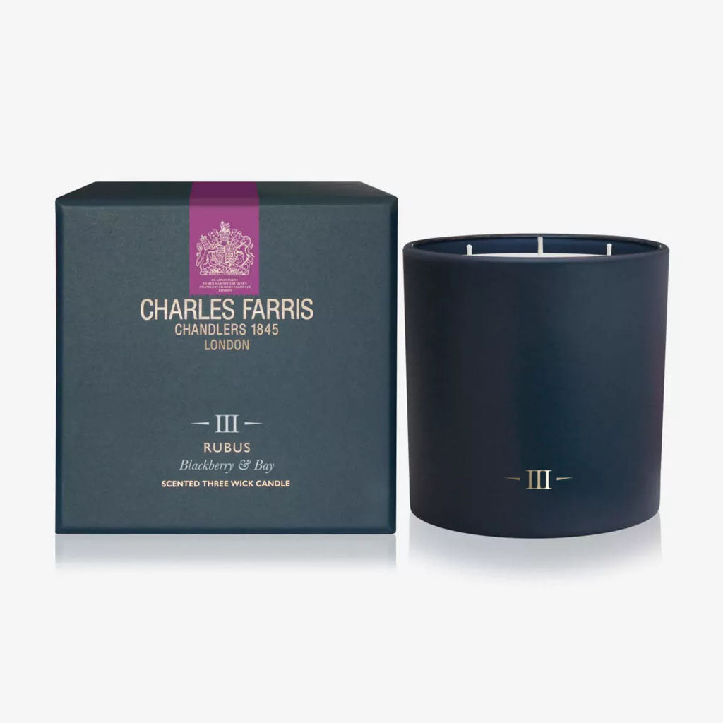 Dark blue candle with 'Charles Farris' packaging on a white background