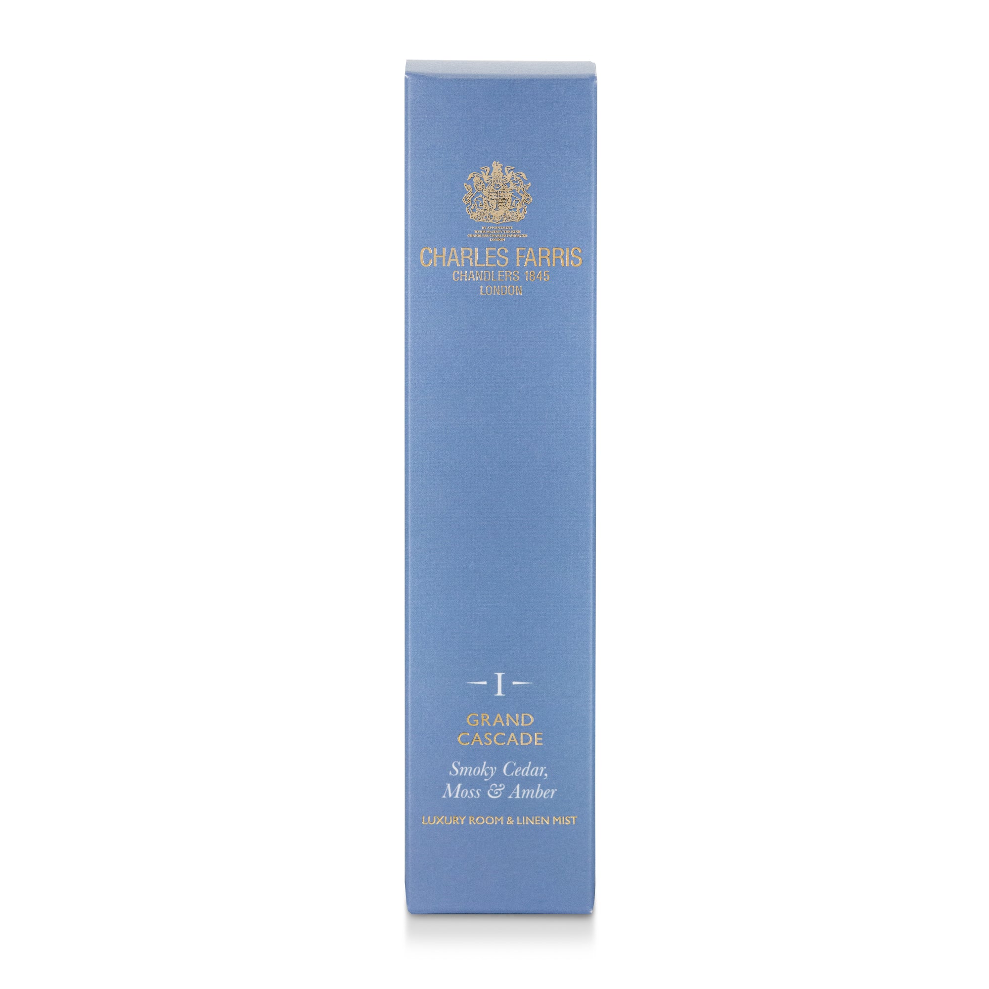 A tall, narrow light blue rectangular box of Charles Farris Grand Cascade, smoky amber premium room spray scented home mist