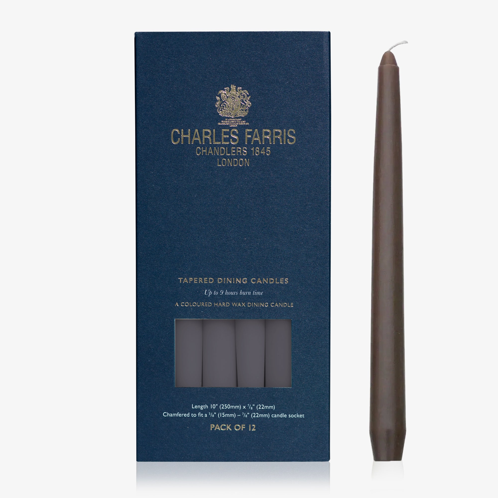 Dark brown taper candle next to its packaging with 'Charles Farris' branding on a white background