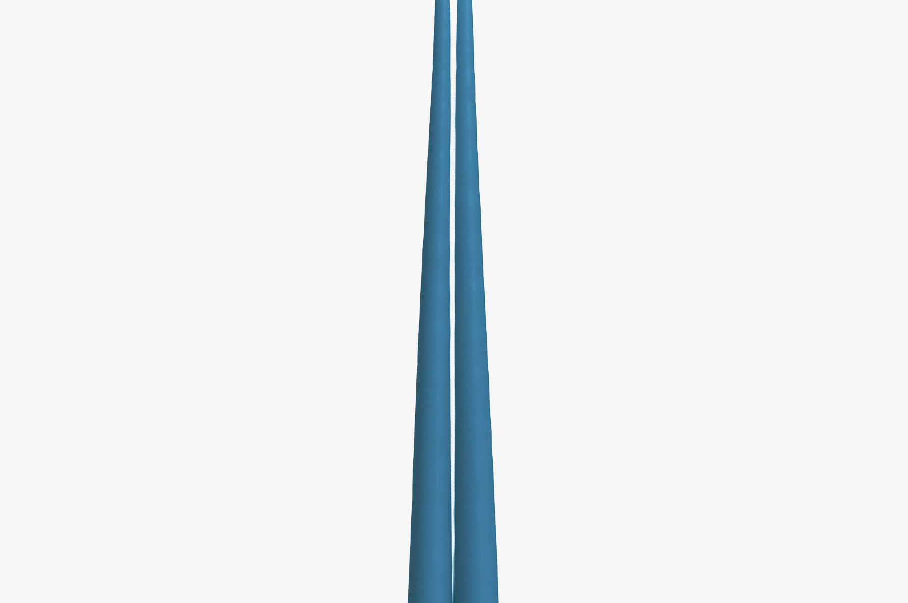 Two blue candles on a white background