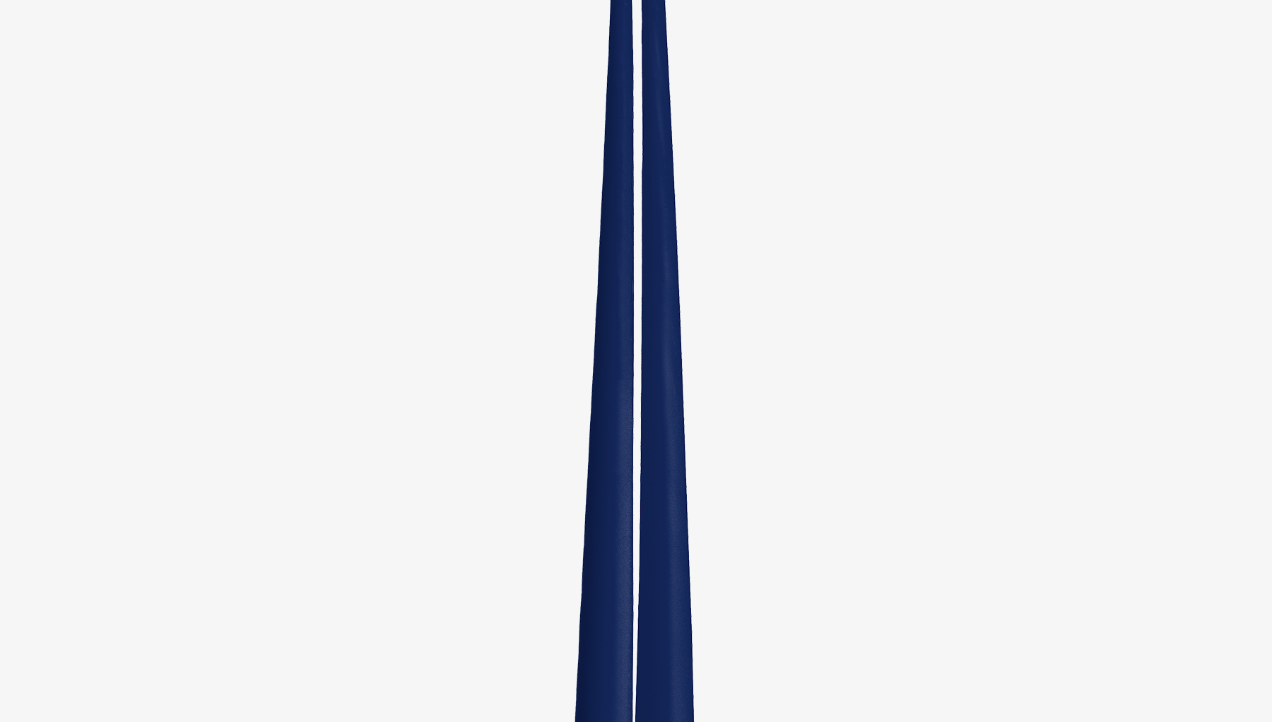 Two navy blue candles on a white background