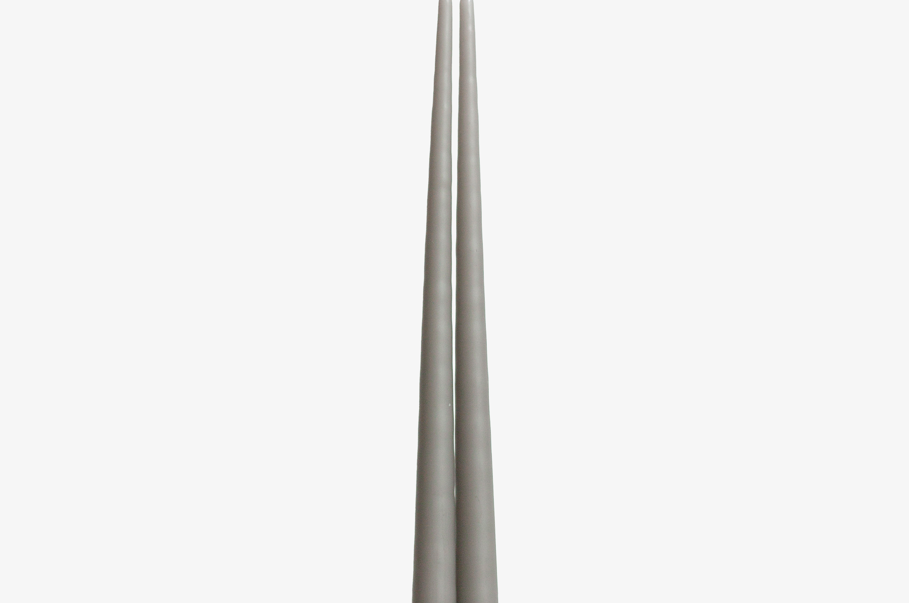Two gray candles on a white background