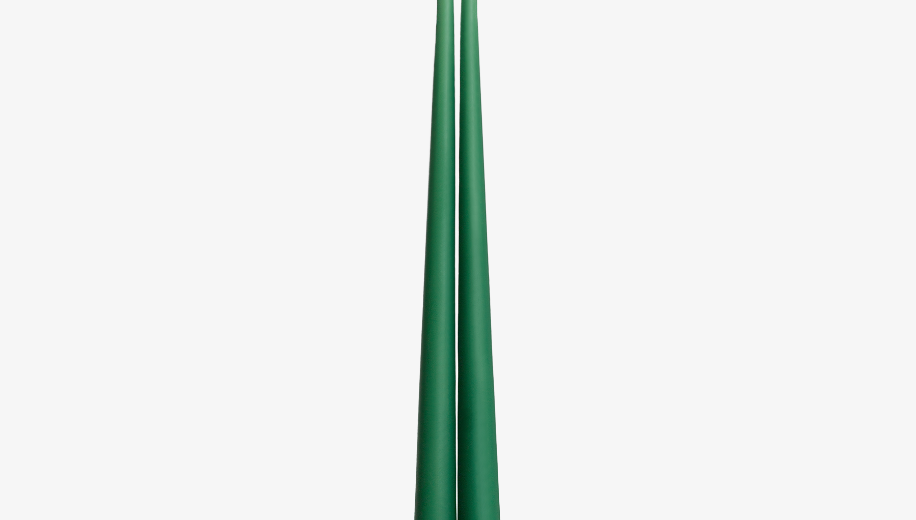 Two green candles on a white background