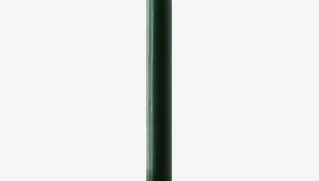 Green candle on a white background