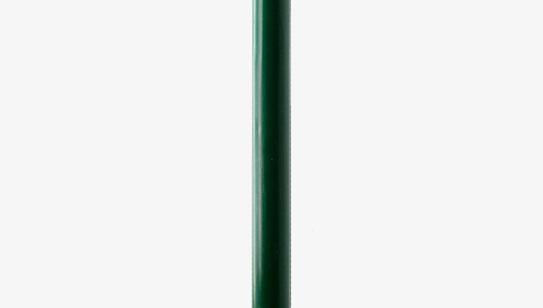 Evergreen fluted dinner candle on a white background