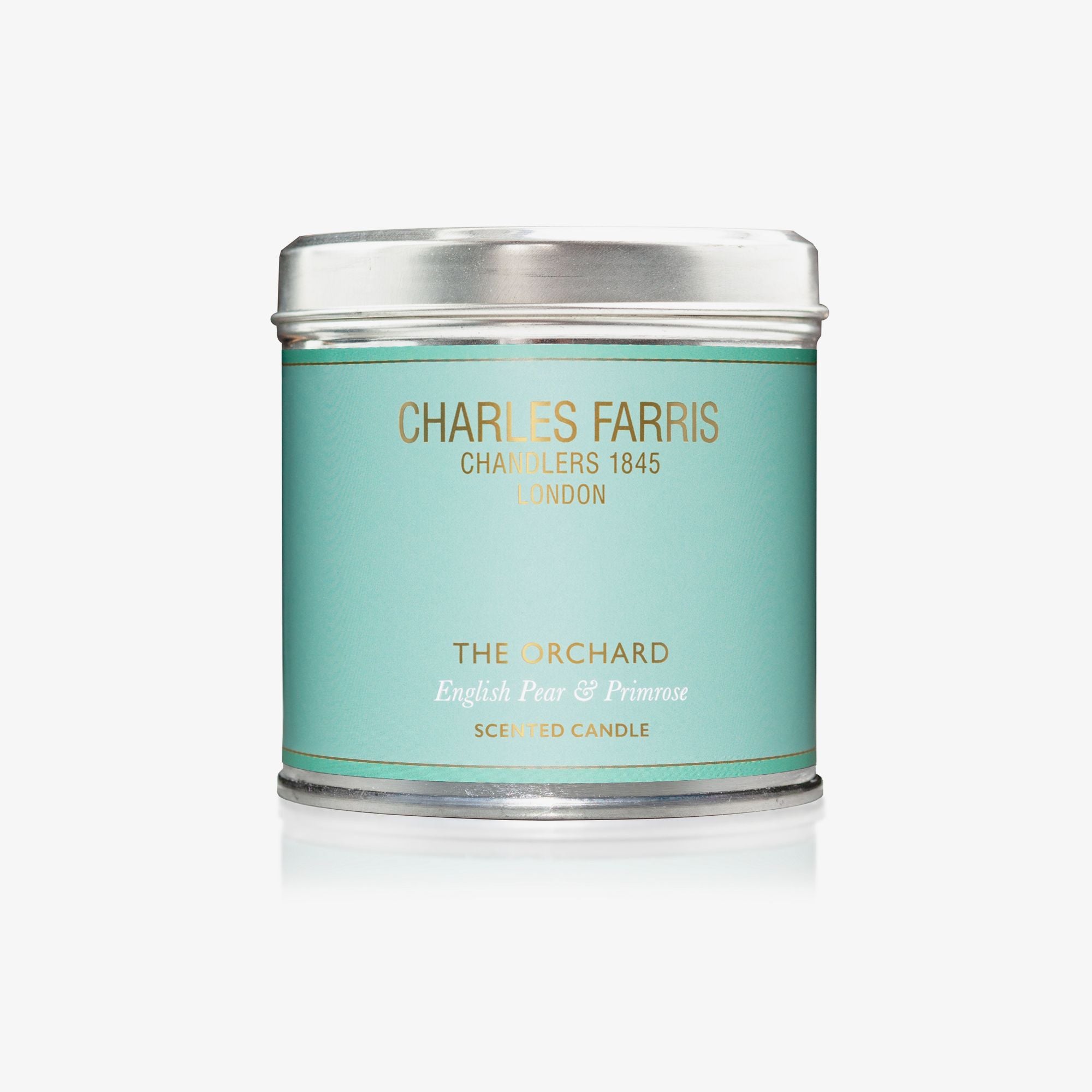 Scented candle tin labeled 'Charles Farris' on a white background