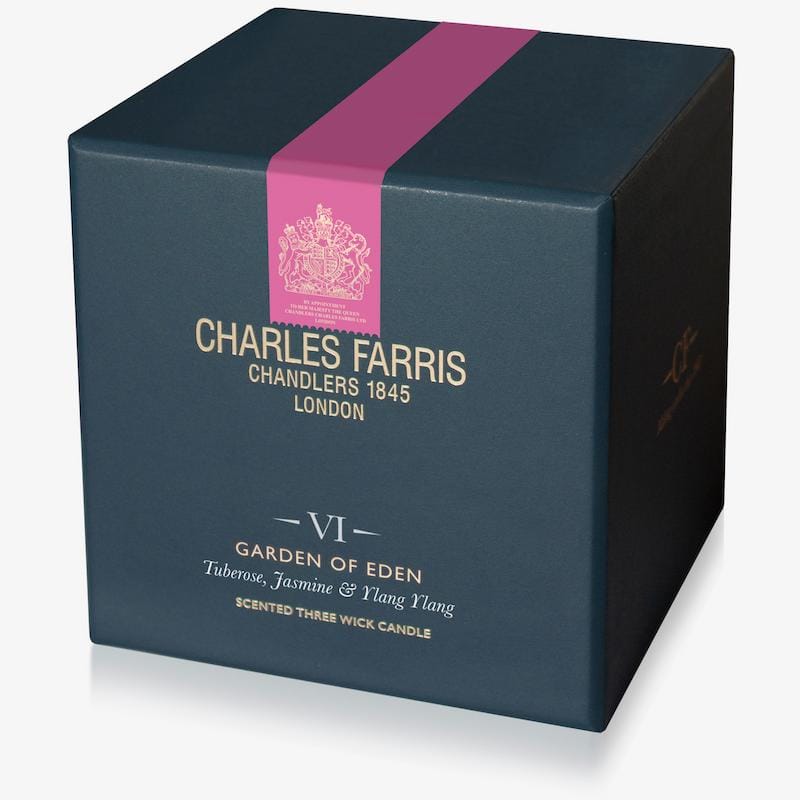 Blue candle box with pink ribbon featuring Charles Farris branding on a white background