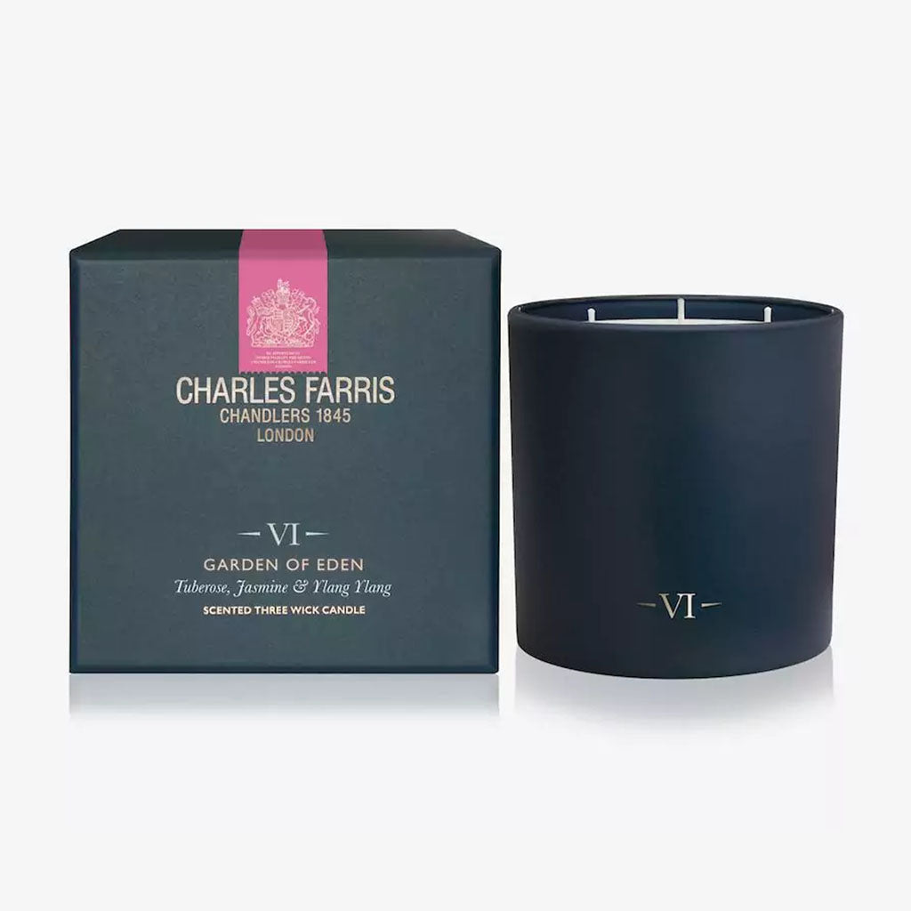 Dark blue candle with 'Charles Farris' packaging on a white background