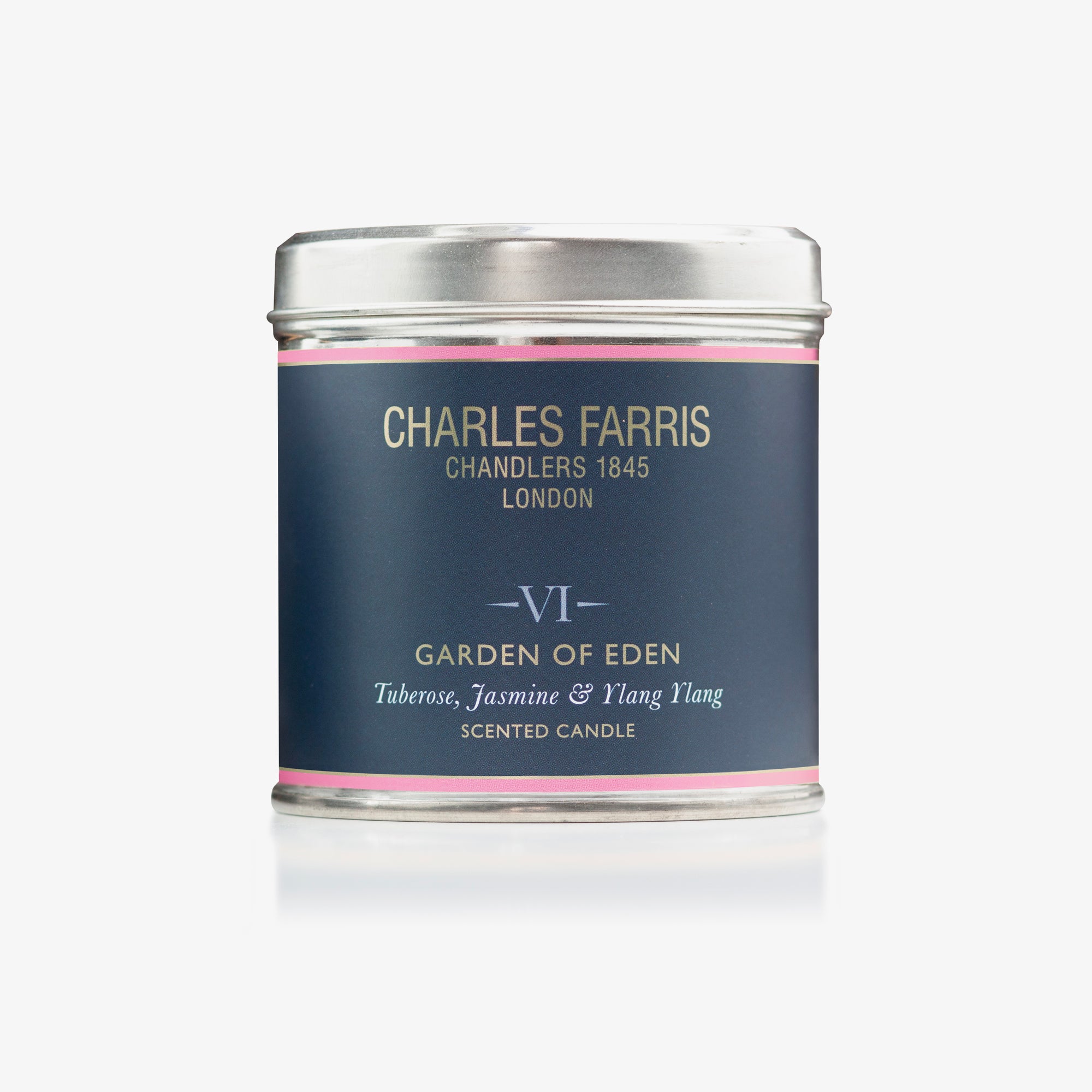 Scented Garden of Eden candle tin labeled 'Garden of Eden' by Charles Farris on a white background