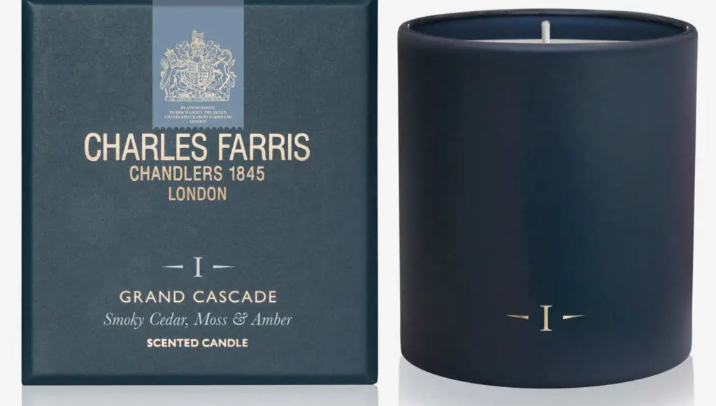 Navy blue candle with 'Charles Farris' packaging on a white background