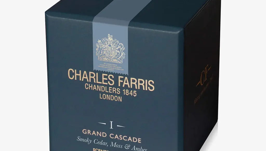 Blue candle box with 'Charles Farris' branding on a white background