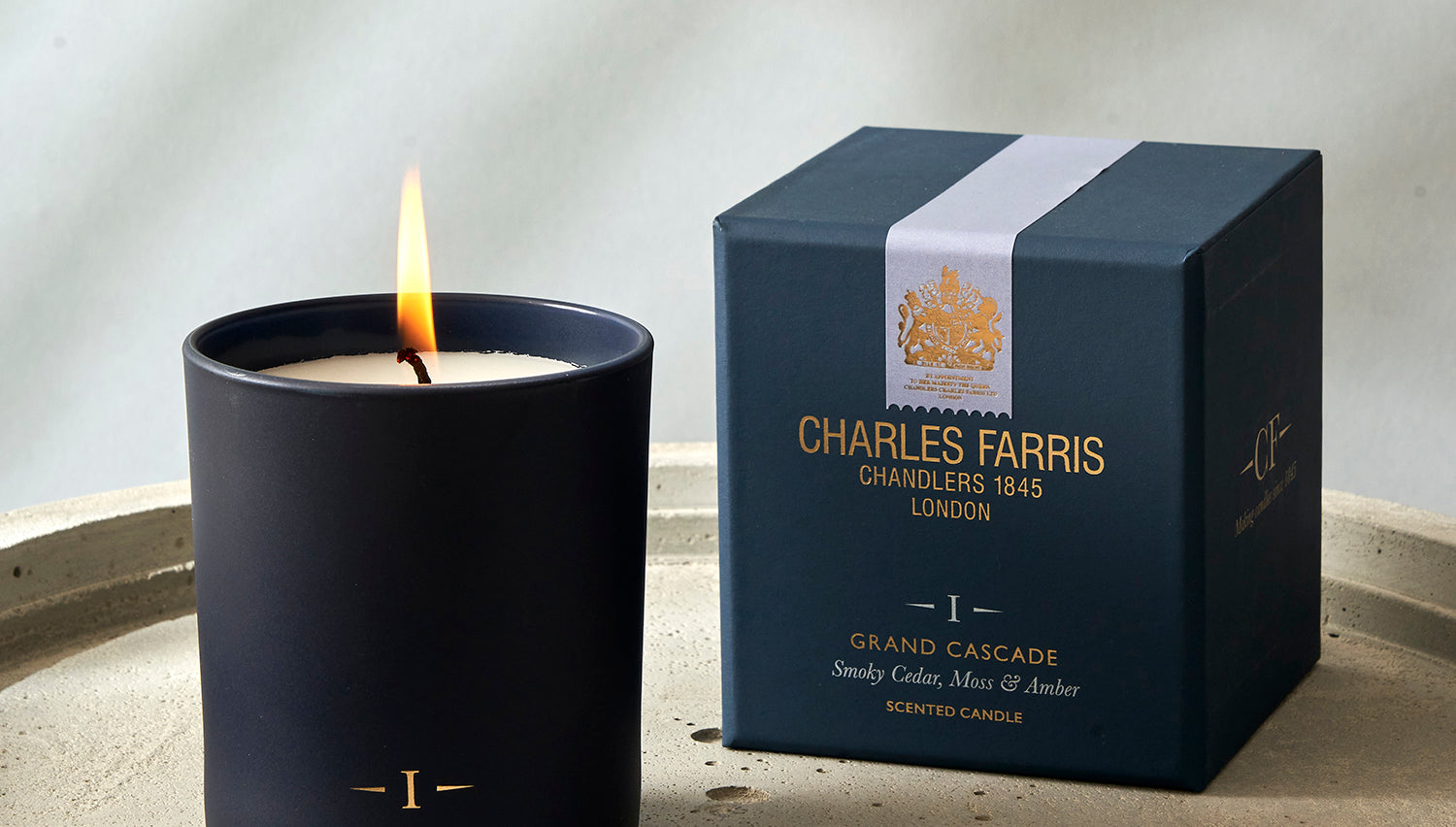 Charles Farris candle and packaging on a neutral background