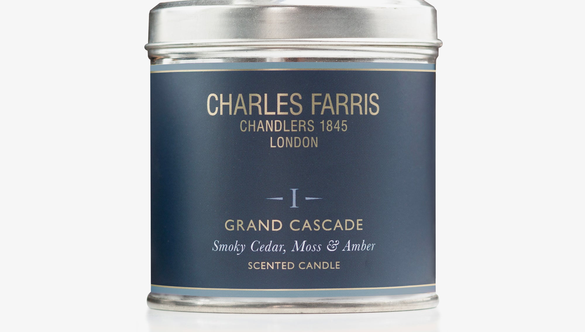 Scented Grand Cascade candle tin labeled 'Charles Farris' on a white background