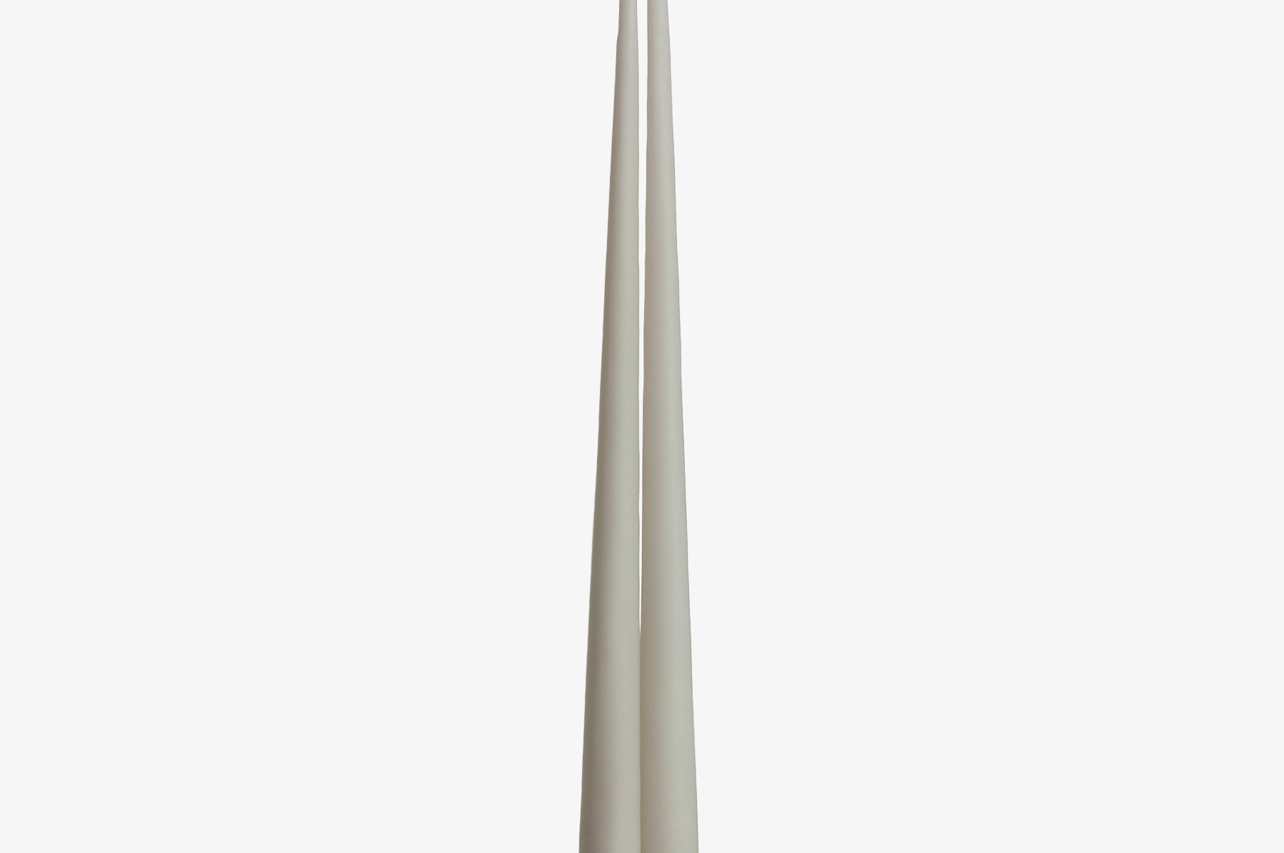 Two grey candles on a white background