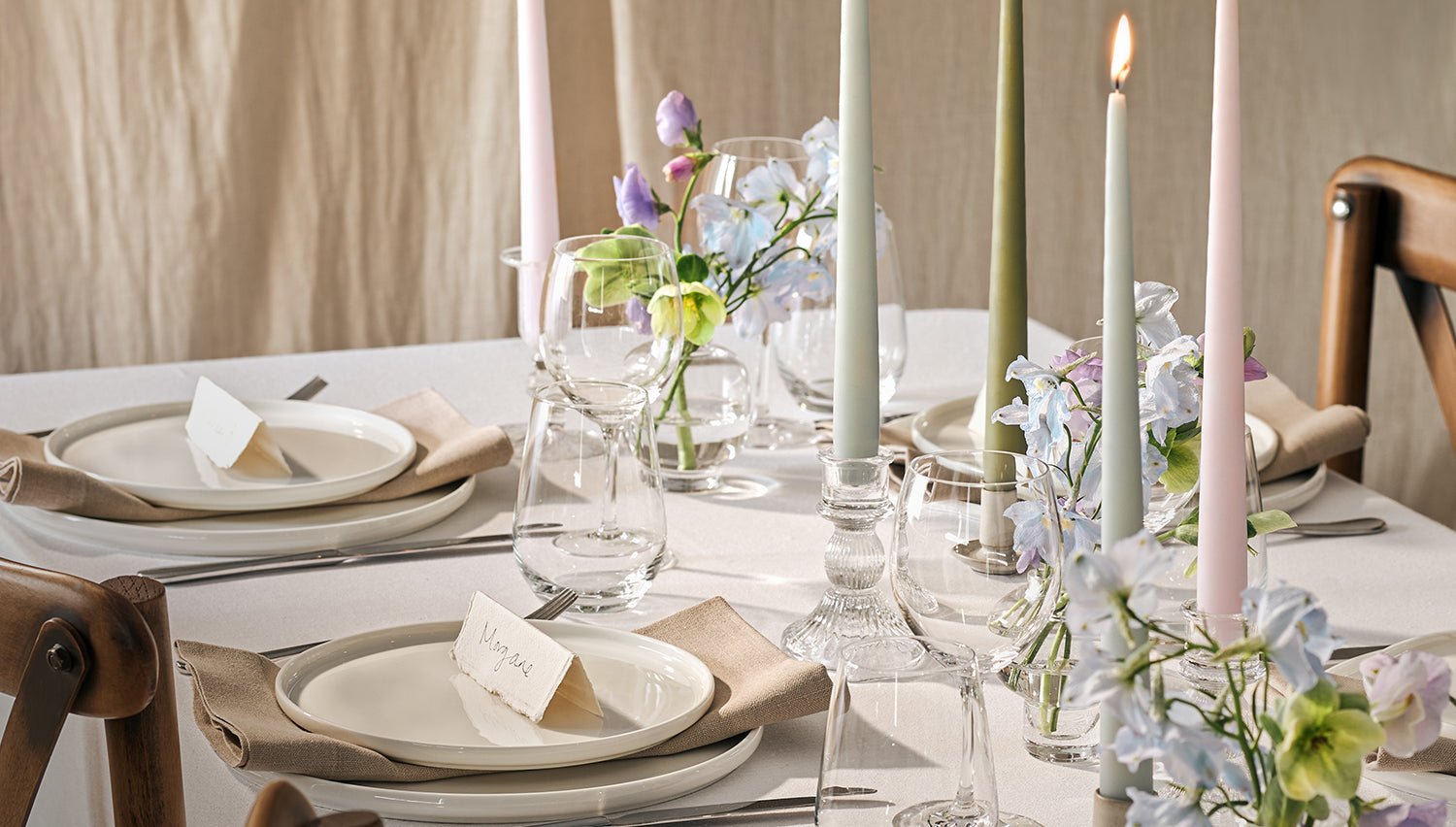 Lit dining candles on a table