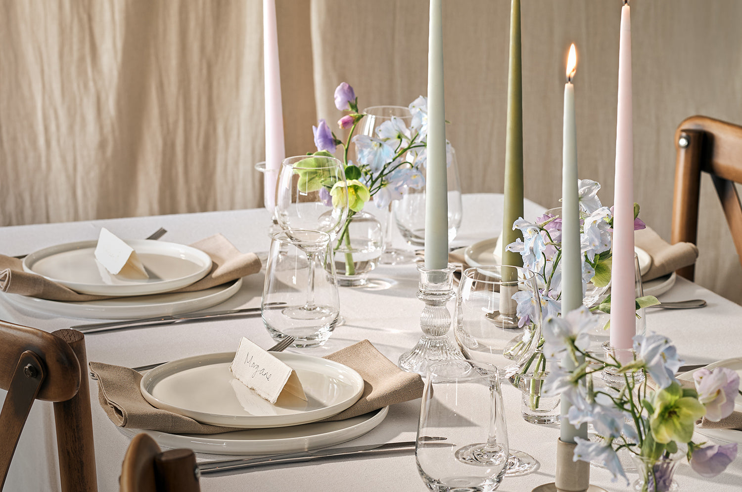 Lit dining candles on a table