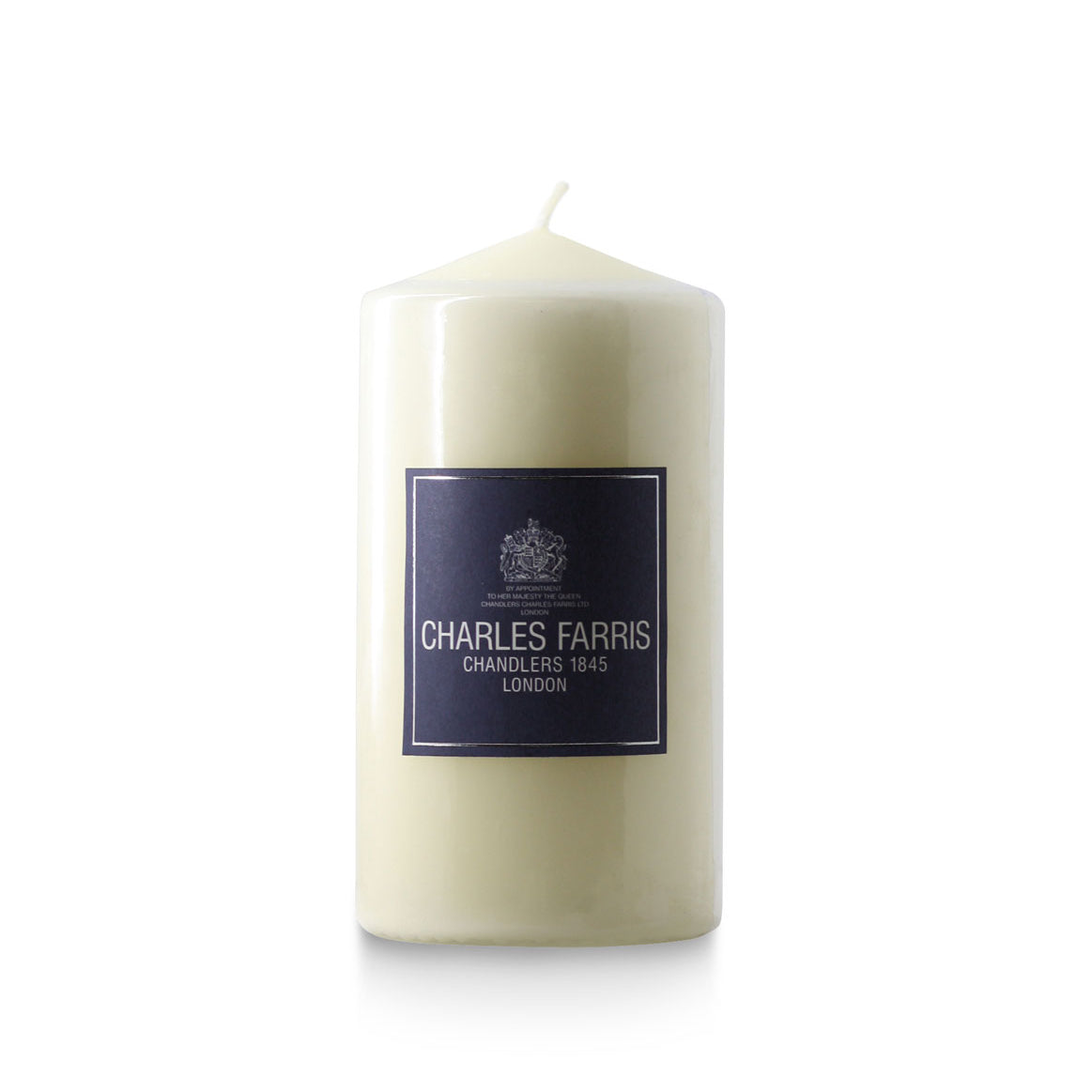 White candle with a 'Charles Farris' label on a white background
