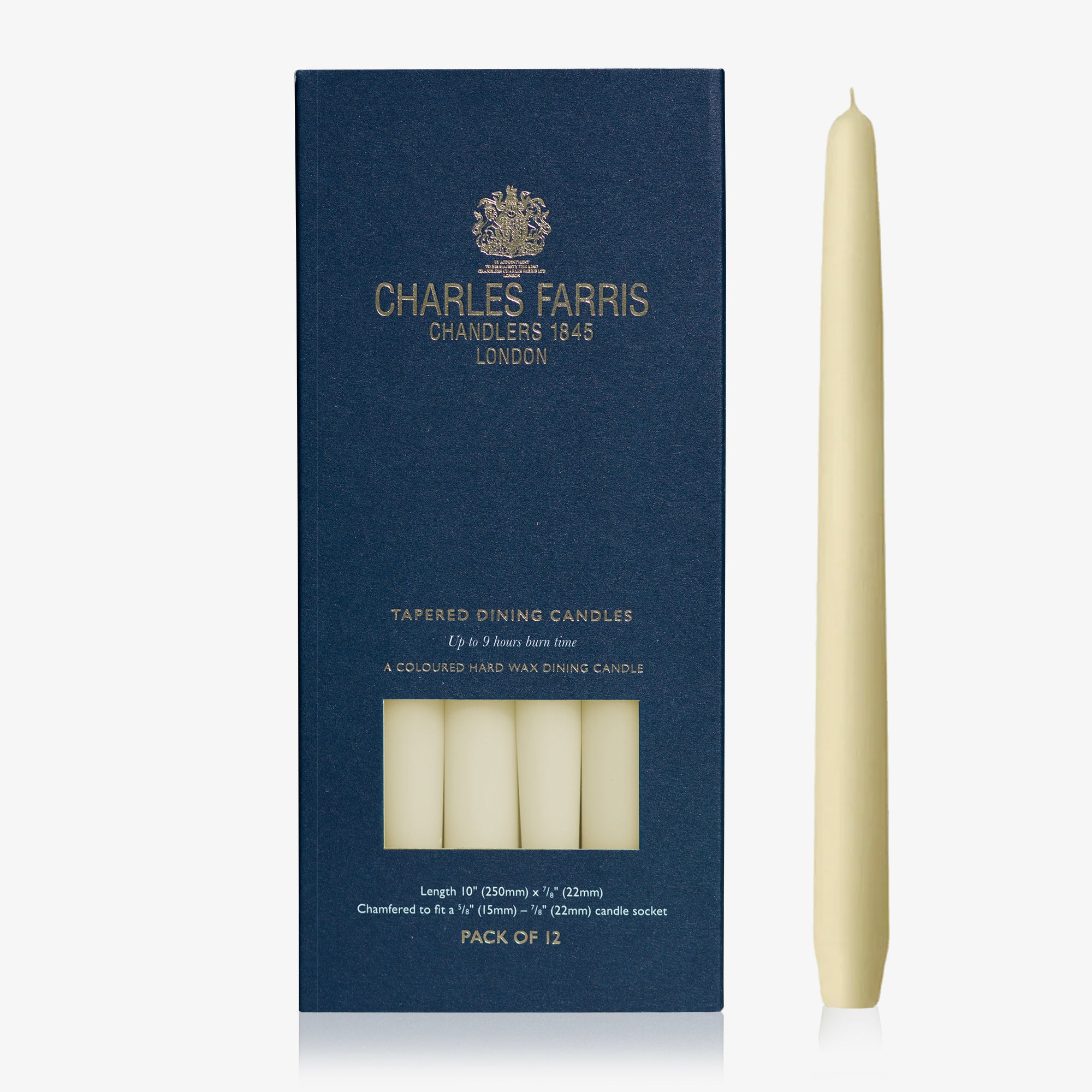 Ivory taper candle next to its packaging with 'Charles Farris' branding on a white background