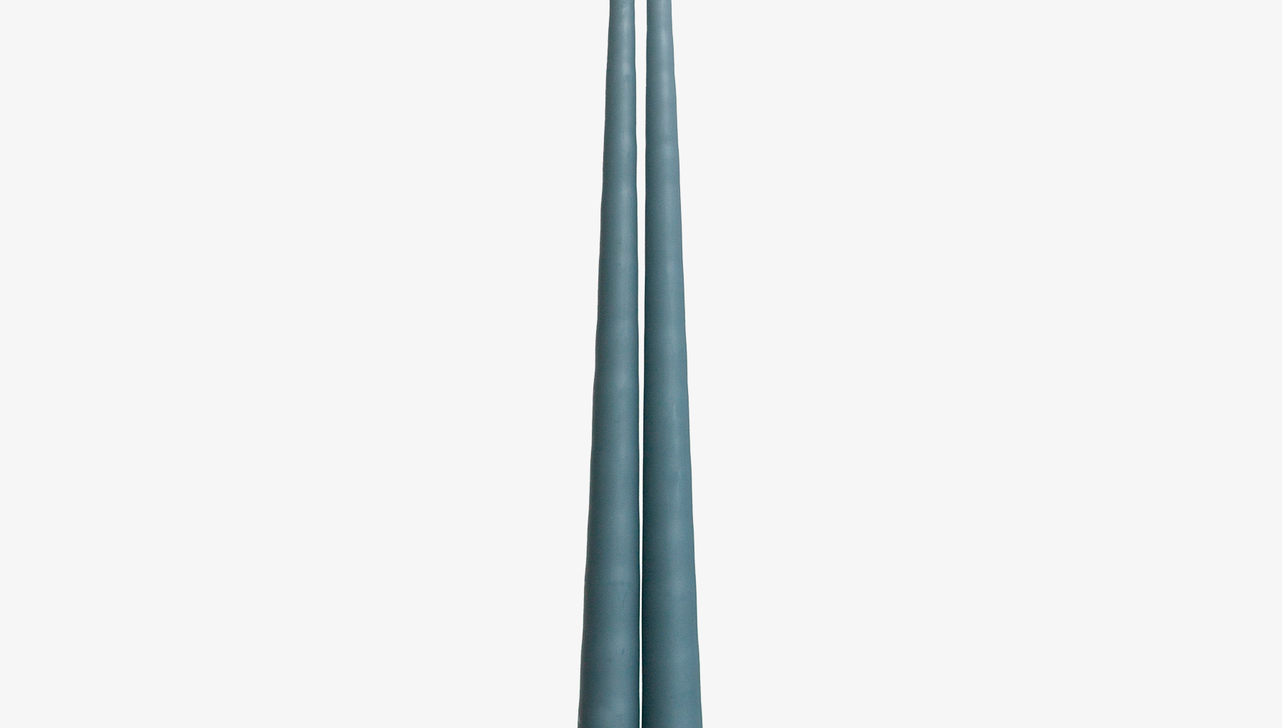 Two blue candles on a white background
