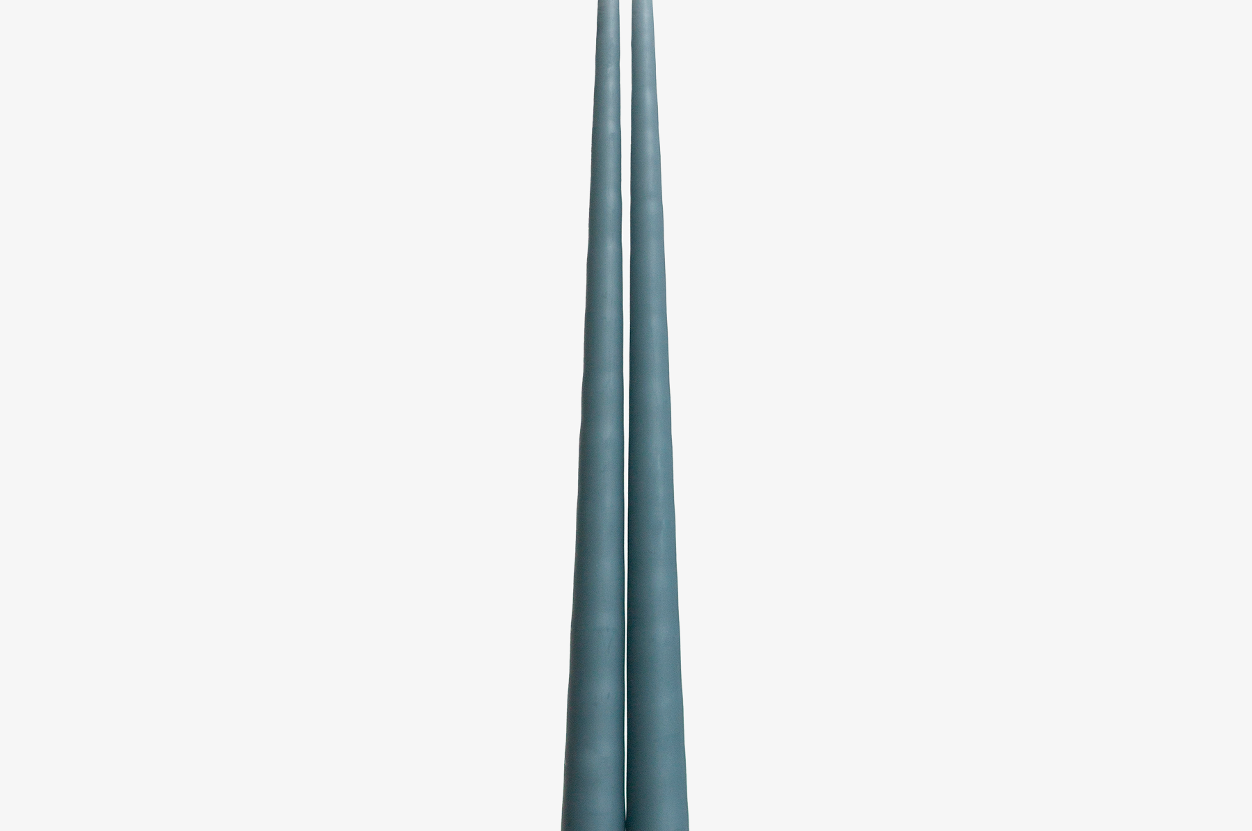 Two blue candles on a white background