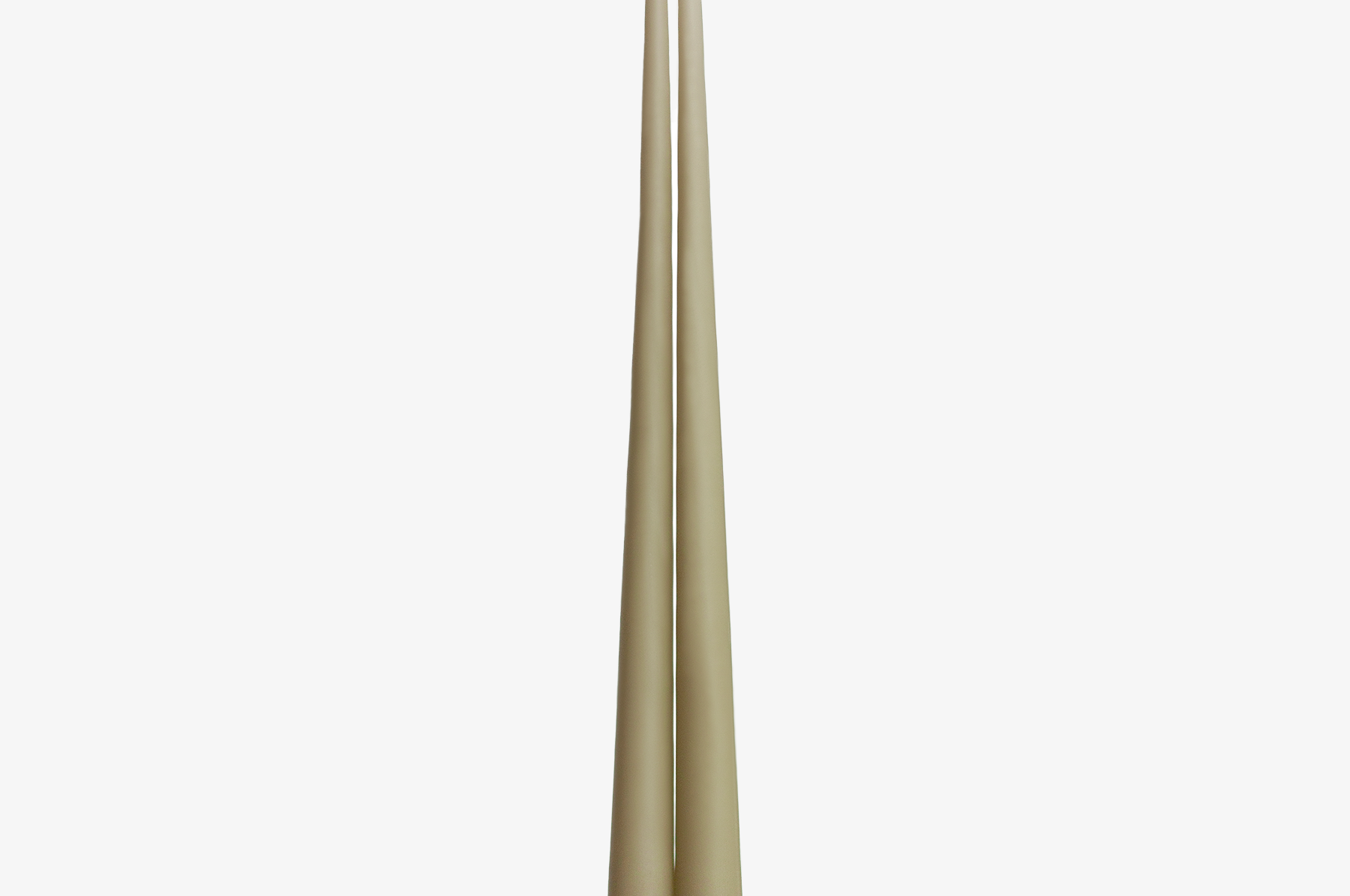 Two beige candles on a white background