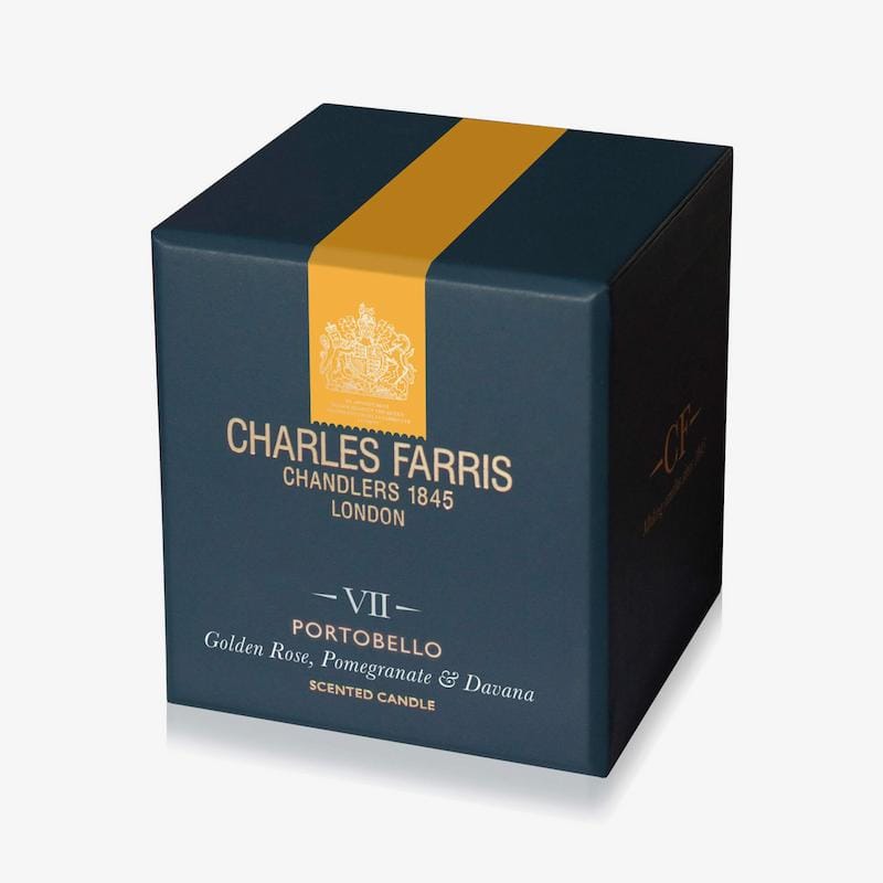 Blue candle box with gold stripe featuring Charles Farris branding on a white background