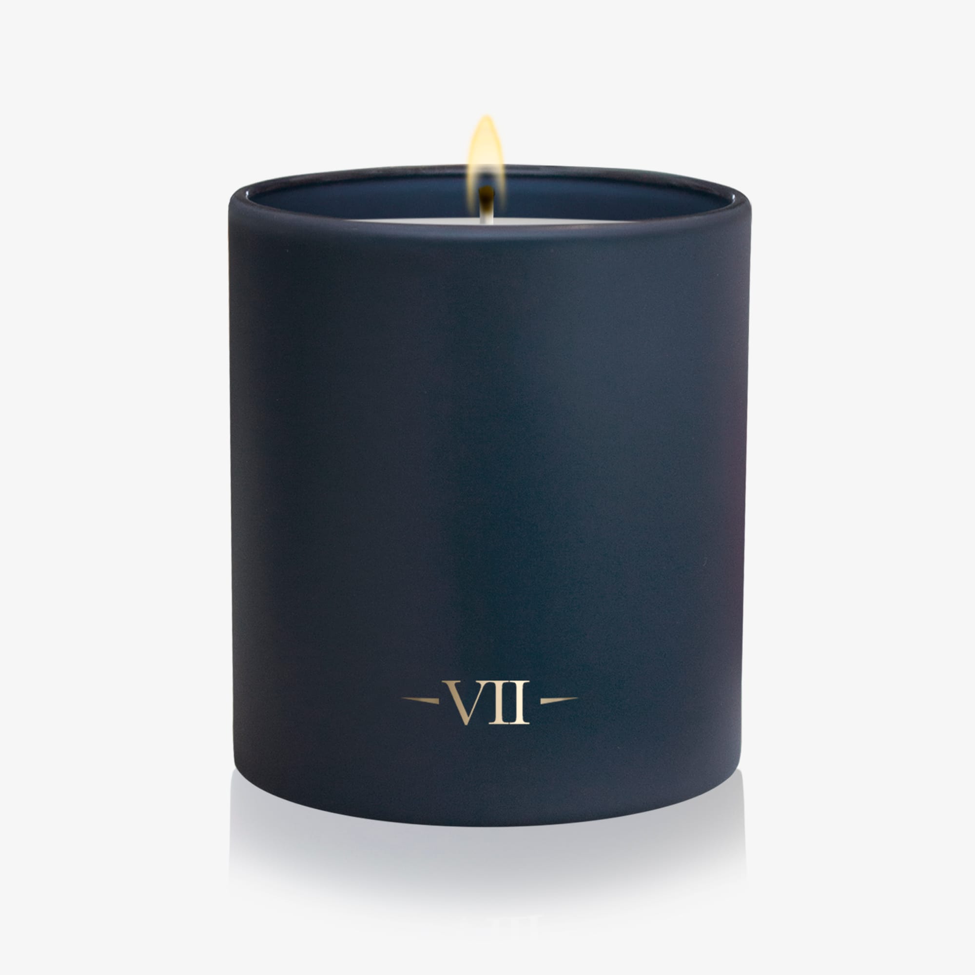 Navy blue candle with 'VII' logo on a white background