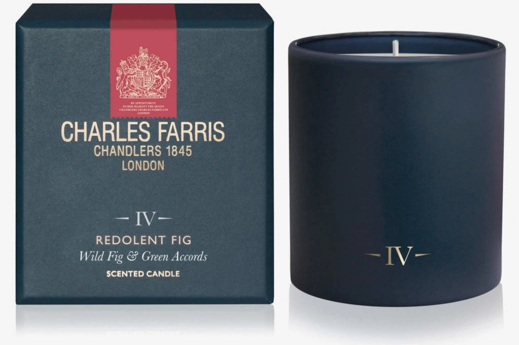 Navy blue candle with 'IV' logo and matching box featuring Charles Farris branding on a white background.