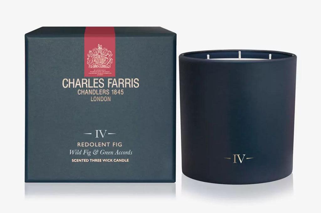 Dark blue candle with 'Charles Farris' packaging on a white background