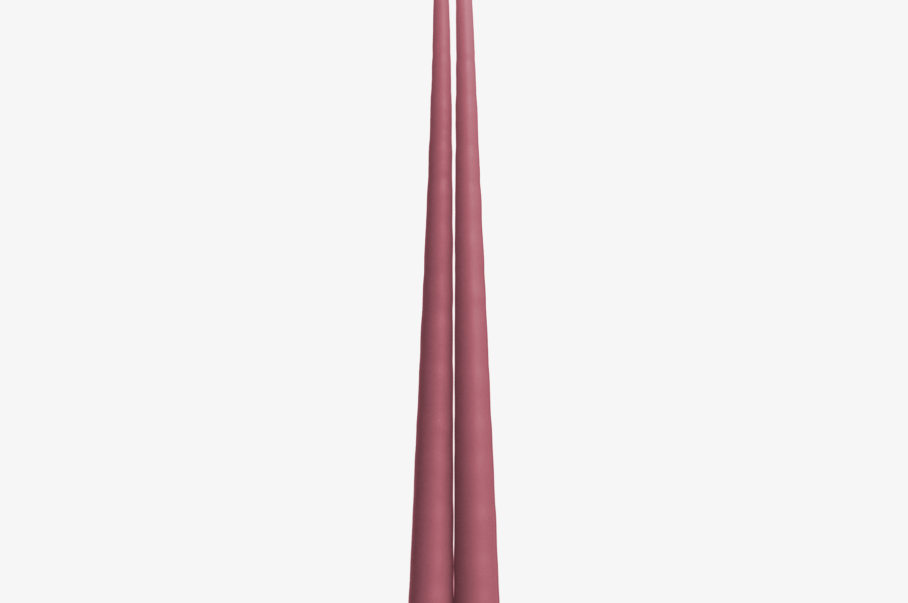 Two pink candles on a white background