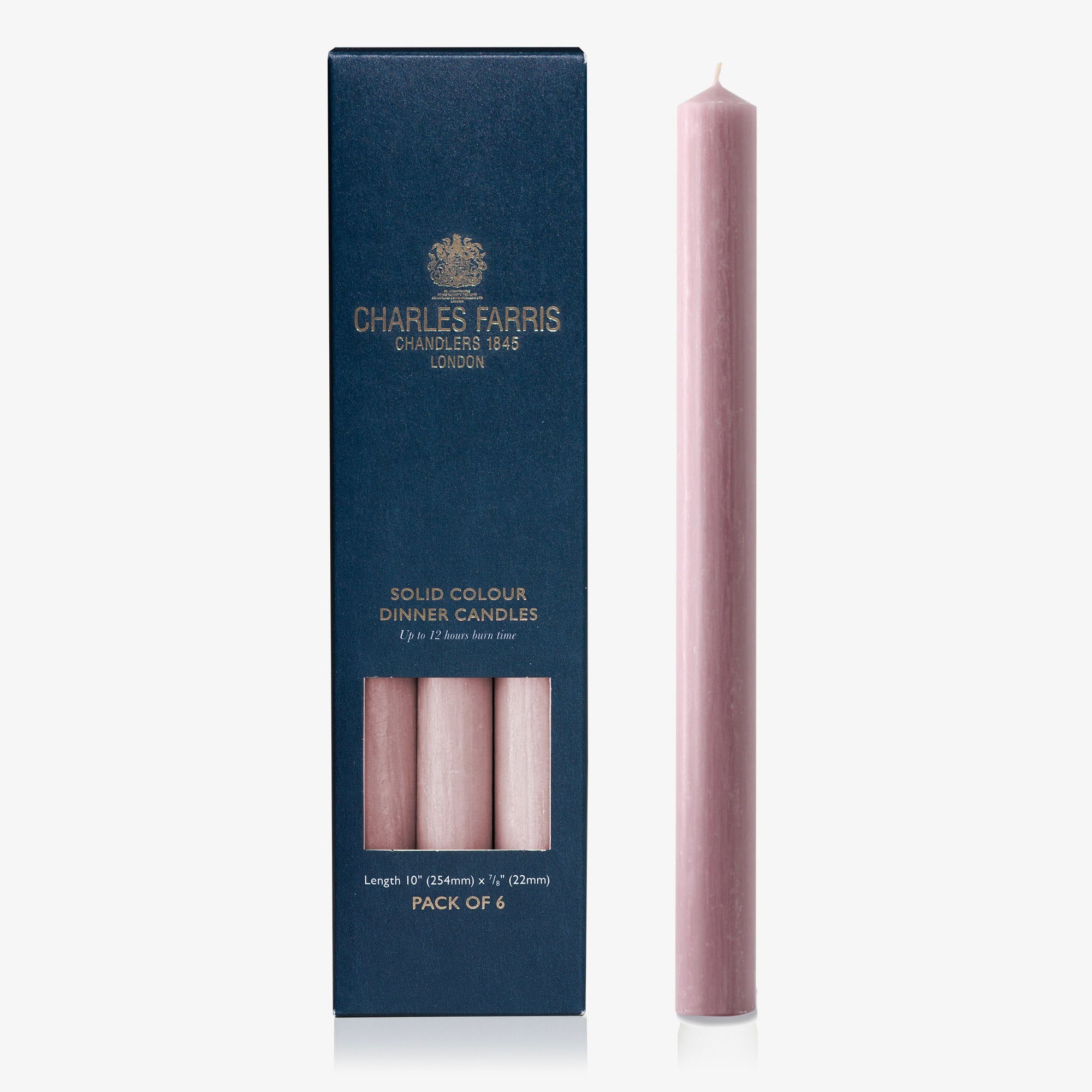 Pink dinner candle with Charles Farris packaging on a white background