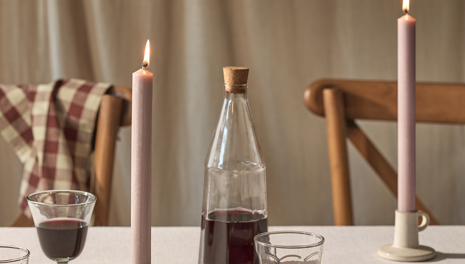 Pink dinner candles on a dining table