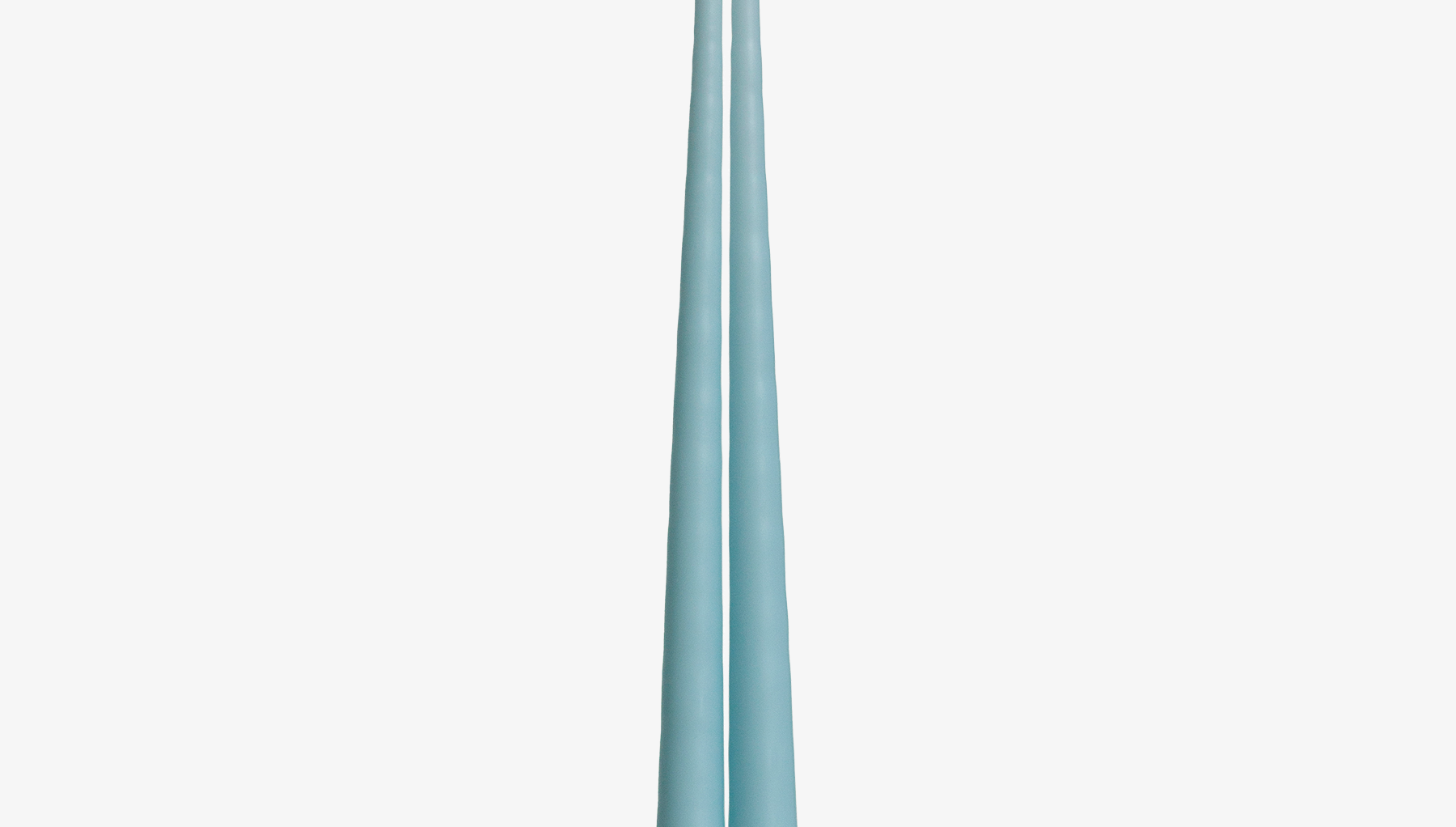 Two light blue candles on a white background