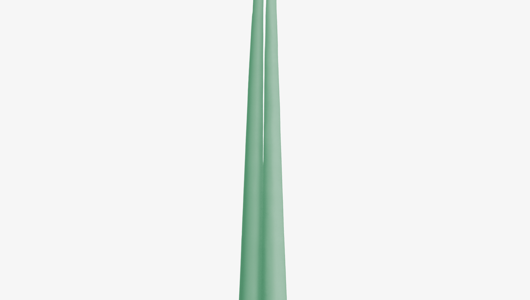 Two green candles on a white background