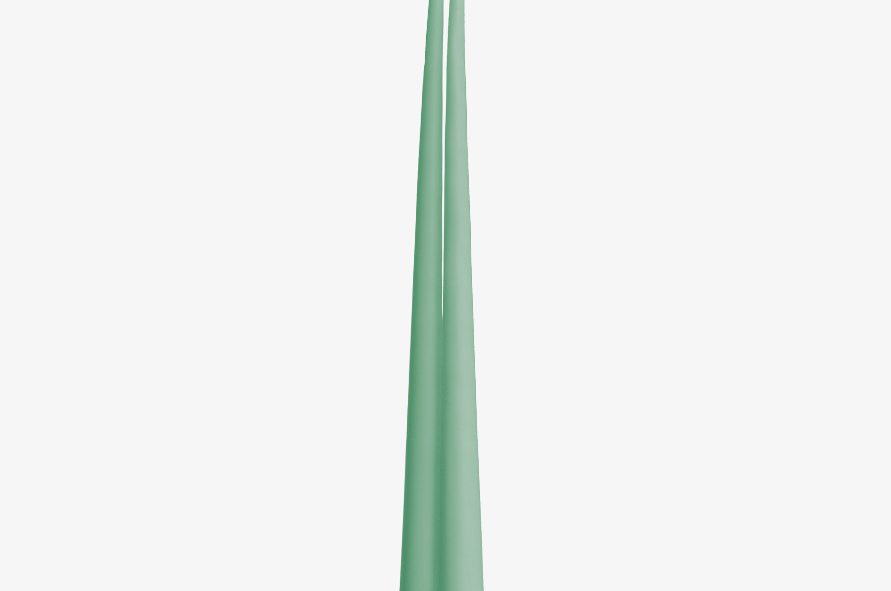 Two green candles on a white background