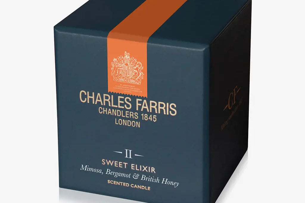 Charles Farris scented candle box with an orange stripe on a white background