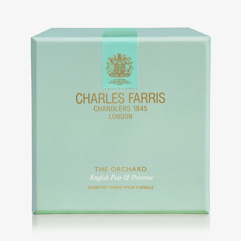 Charles Farris candle box with green design on a white background