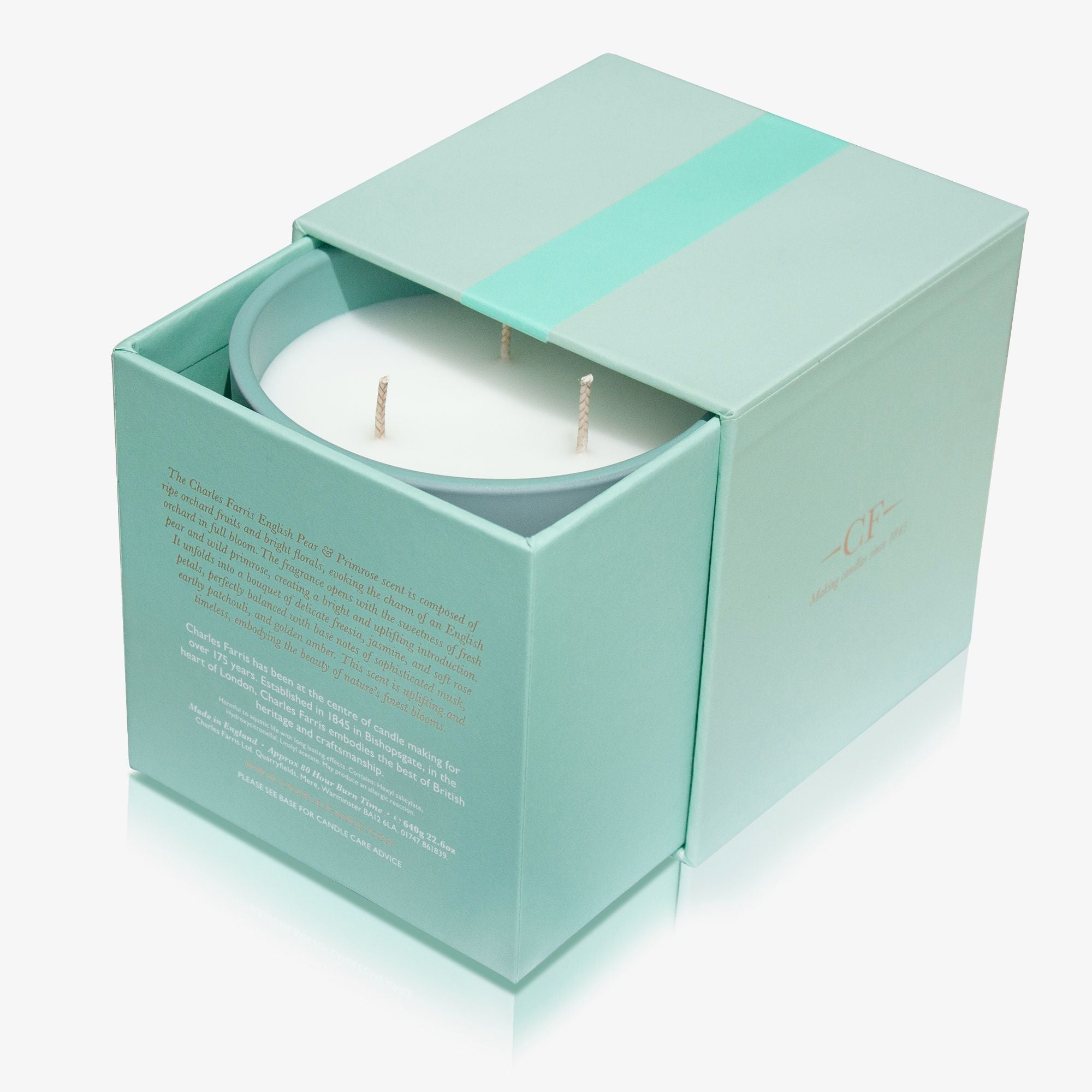 Candle in a light blue box on a white background