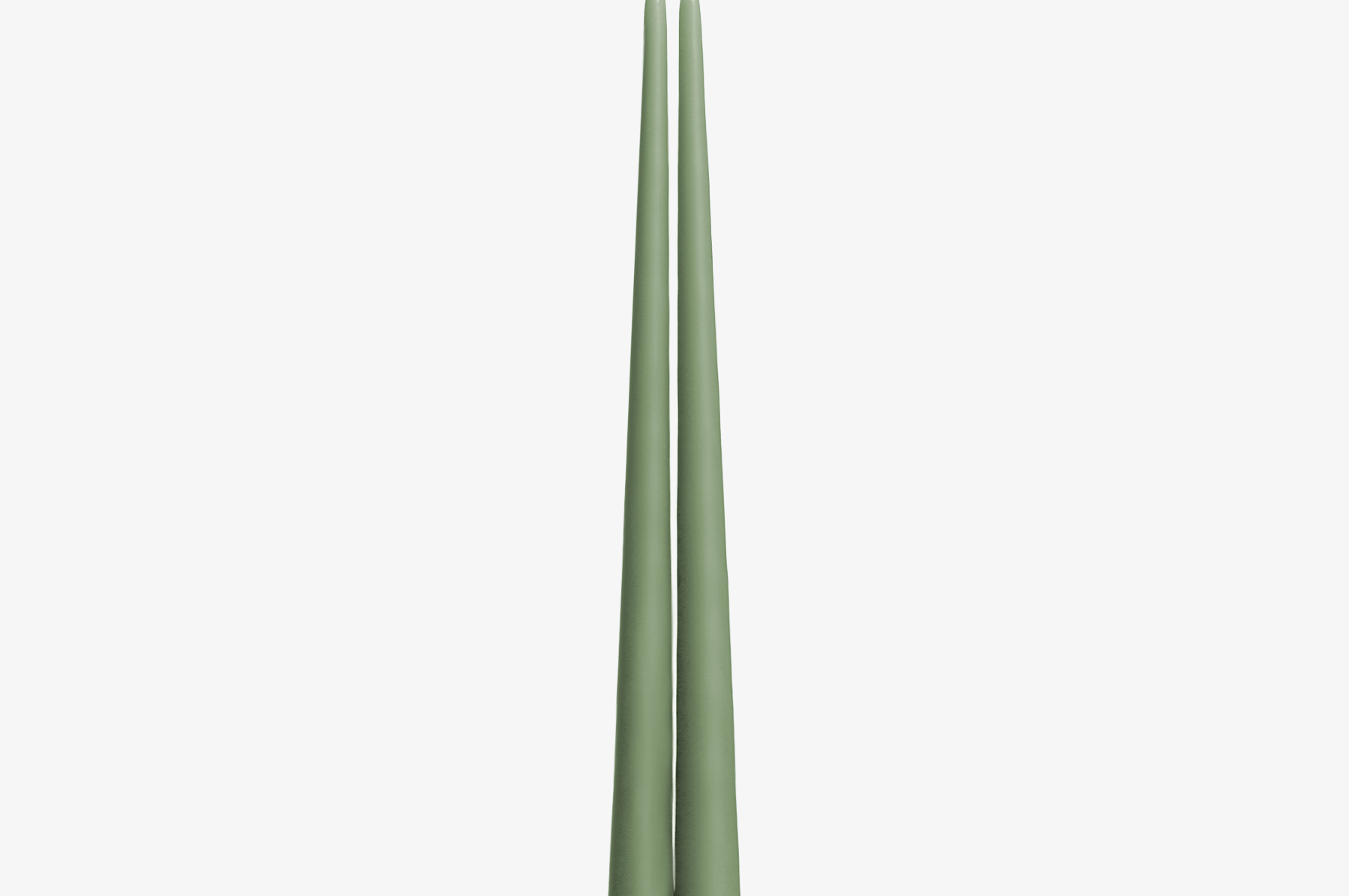 Two green candles on a white background