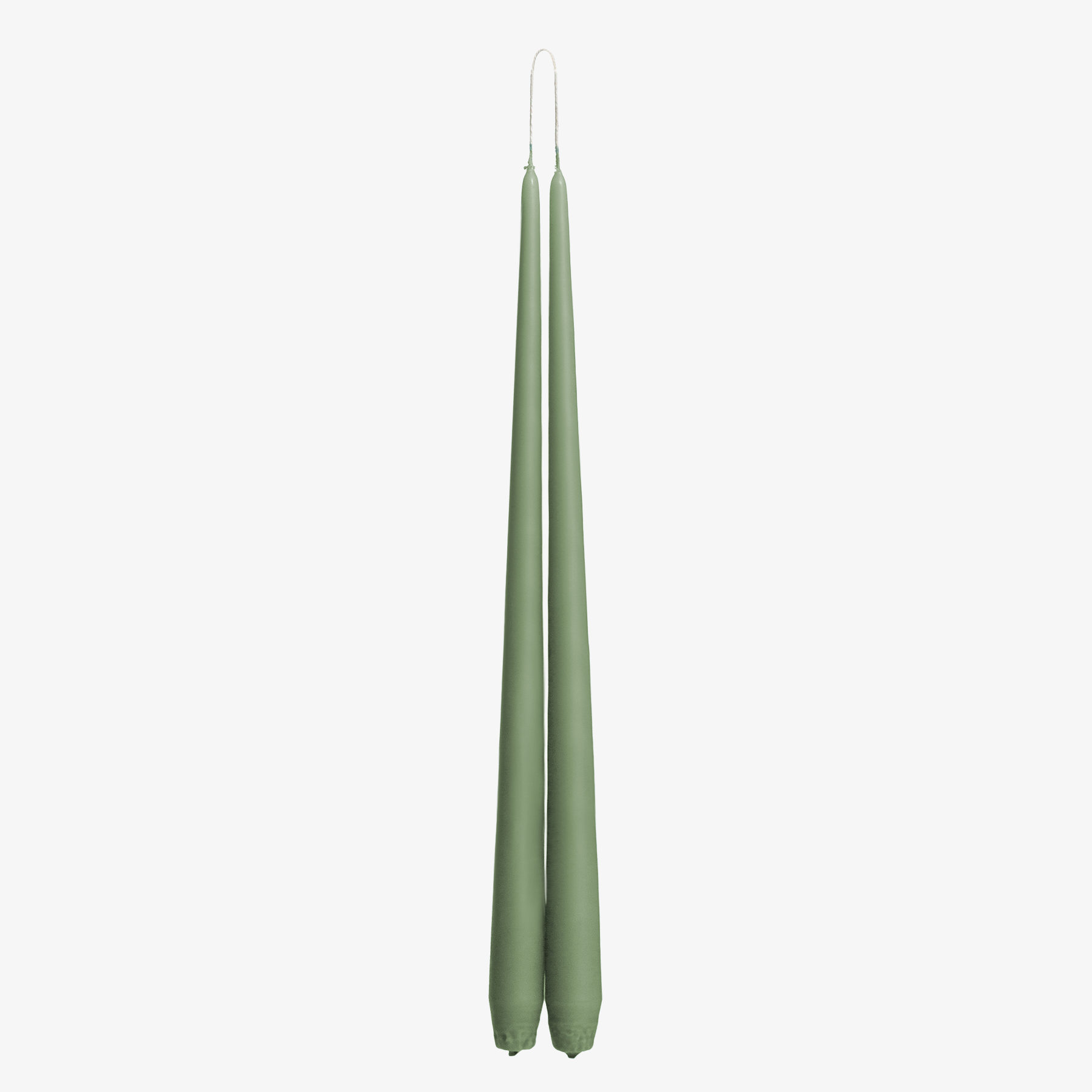 Two green candles on a white background